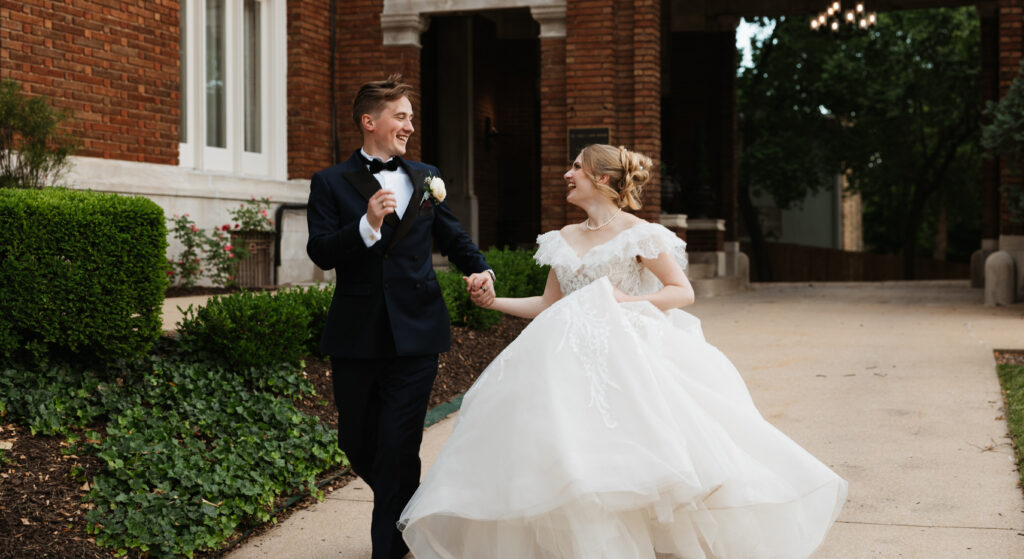 bride and groom running across the street